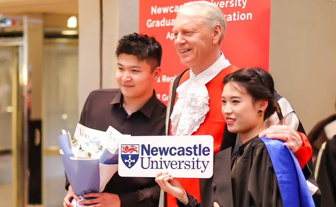 Vice-Chancellor and President, Professor Chris Day taking a picture with graduates at the graduation celebration event in China